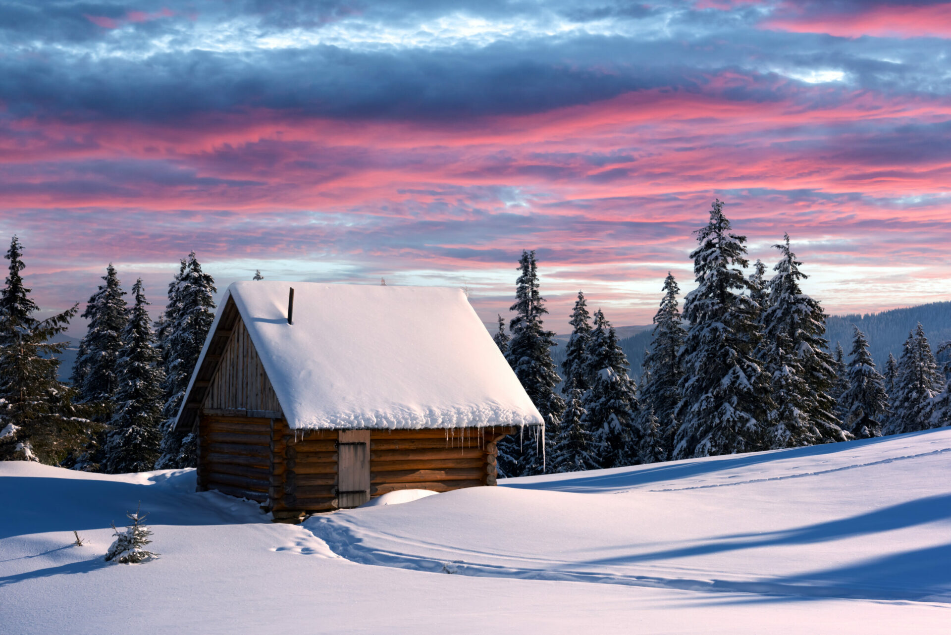 Keep your plants watered-Fantastic winter landscape with wooden house in snowy mountains. Christmas holiday concept.