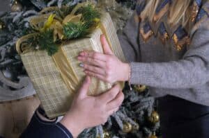 man-gives-a-woman-a-gift-in-a-holiday-package- Grow Citrus Trees Indoors