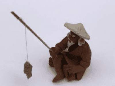 Miniature Ceramic Figurine Unglazed Fisherman